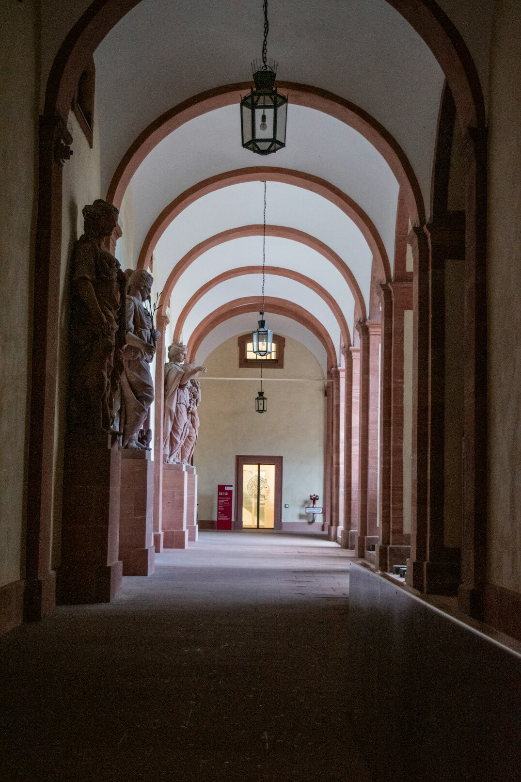 Long museum corridor with soft overhead light