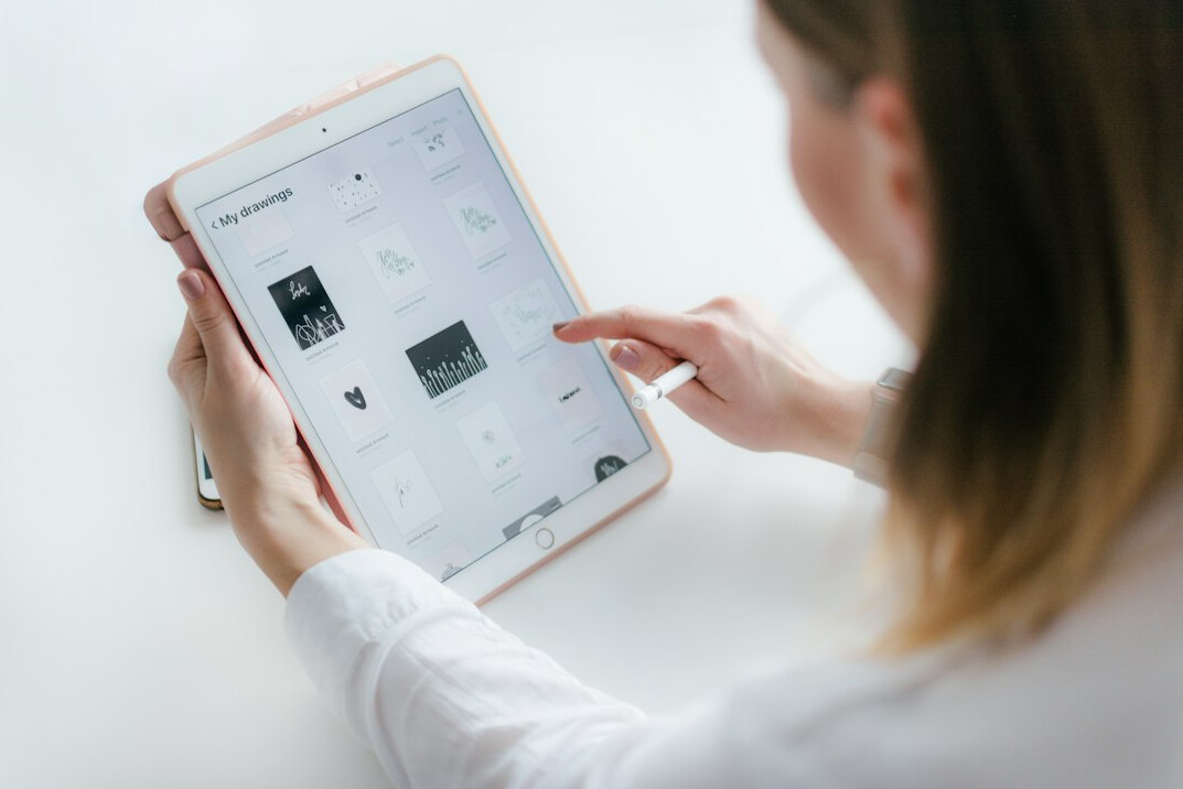 person reading news on tablet